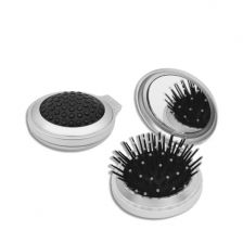 Pocket mirror with foldable hairbrush